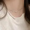 Collar de hueso de serpiente con lazo plateado para mujer, nicho de lujo ligero de verano, cadena de clavícula de alta gama, nuevo estilo 2024, pulsera estilo frío