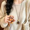 Nuevo collar colgante de oso retro estilo chino para mujer, cadena para suéter de diseño único, accesorio de moda, simple, versátil al por mayor