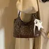 Bolsa de mão simples 2026, novo design coreano de outono com estampa floral, design de estrela, estilo retrô, bolsa de ombro pequena, design de nicho
