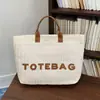 Bolso nuevo con sensación de alta gama, bolso grande de paja para mujer, bolso de playa estilo vacación de verano en la costa, bolso de hombro único para mujer