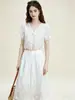 Conjunto de Dos Piezas Calado Bordado Francés Original Nanyou 2026 Verano Top Corto con Cuello en V y Lazos Falda Larga de Cintura Alta Resort
