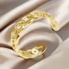 Anillo de acero de titanio chapado en oro de moda europea y americana, diseño de nicho de alta gama para mujer, anillo ajustable de acero inoxidable hueco con apertura
