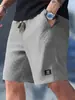Shorts casuais esportivos masculinos europeus e americanos transfronteiriços, shorts versáteis de verão de tamanho grande com corte solto, shorts com estampa de abacaxi para homens