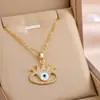 Collar Cruzado Europeo y Americano Nuevo Ojo de Diablo Turco para Hombres y Mujeres Chapado en Oro Gota de Aceite de Palma Ojo Colgante de Fátima