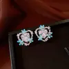 Brincos de tarracha coração com flor e gota de óleo azul agulha de prata design fresco estilo doce brincos simples modernos sensação de alta qualidade joia para orelha