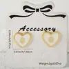 Distrito de Lu pendientes cruzados de cobre nuevo oro 18K aceite amor retro INS simples nicho pendientes retro mujeres al por mayor