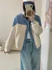 Cárdigan de lana de doble cara tejido con retazos de mezclilla estilo europeo, nuevo modelo otoño/invierno 2026, chaqueta suéter versátil de bloques de color para mujer