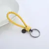 Nuevo Llavero de Cuerda de Cuero de Acero de Tungsteno Tejido a Mano Regalo Creativo Colgante Universal para Coche Llavero Grabado Venta al por Mayor