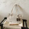 Bolso de mujer de diseño nicho 2026 nuevo bolso de hombro cruzado de verano versión coreana ins bolso de mano de lunares bolso tote