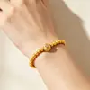 Pulsera de ocho puntas en forma de estrella, con acabado cepillado en oro de arena, adornada con diamantes rosas, cuentas redondas chapadas en oro y detalles de circonita, en un nuevo estilo chino, versátil para cualquier atuendo