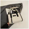 Bolso de lona de gran capacidad para mujer, nuevo bolso bandolera de un solo hombro de alta gama, versátil, para uso laboral, 2025