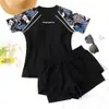 Nuevo traje de baño de mujer estilo tankini 2026, adelgazante y que esconde la barriga, de manga corta, adecuado para aguas termales, playa y vacaciones en resorts, conjunto de dos piezas