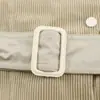 Fabricante mayorista de ropa de mujer transfronteriza 2026 Estilo europeo y americano color liso versátil entallador a la cintura gabardina corta flockeada