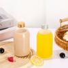Botella de bebida, botella de vino de frutas, venta al por mayor, botella de té con leche, tapa de aluminio transparente, botella de jugo, jugo de frutas y verduras, botella de vidrio vacía, botella de café