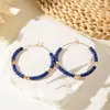Europa y Estados Unidos aretes nuevos de lujo franceses transfronterizos retro moda aretes versátiles resina color oro cuentas joyería