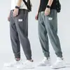 Calça Casual Masculina de Seda Gelada Nove Pontos Calças Masculinas Verão Fina Estilo Hong Kong Tendência Esportiva Perna Larga Respirável Calças de Verão