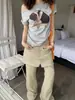 Estilo Nuevo de Verano Retro Holgado Estampado de Personajes Hombros Descubiertos con Hombro Diagonal Mangas Cortas y Camiseta de Letras