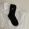 Buenos calcetines coreanos Corea del Sur ins blogger de moda combinación de colores bordado lazo calcetines de canalé niños calcetines Zhuji