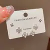 Conjunto de brincos de três peças estilo francês minimalista, formato gatinho, com pedra de trevo de quatro folhas, para mulheres, requintado, pequeno, versátil e deslumbrante - atacado