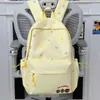Mochila de Viagem Feminina Estilo Japonês Cor Azul Claro Estampa de Laços Mochila para Passeio de Estudante Piquenique