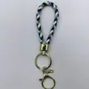 Venta al por mayor del fabricante Llavero de Cuerda de Aleación Tejida y Cuero Accesorios Colgantes Material PU Bolsas Pequeñas de Regalo Accesorios para Llaveros