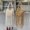 Bolso tejido para mujer, nuevo modelo de verano 2026, nicho y súper popular, bolso de hombro para el trabajo, bolso cruzado con borlas, bolso de playa de paja