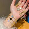 Pulseira de Trevo de Quatro Folhas com Zircônia, Design Versátil, Pulseira Fashion para o Dia a Dia, Luxo Leve, Joias de Alta Qualidade para Mulheres Atacado