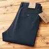 Estilo popular continúa otoño e invierno nueva textura sarga elástica pantalones largos de negocios de alta gama rectos versátiles pantalones casuales para hombre