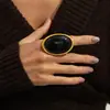 Anillo de banda ancha martillada estilo palacio ins, anillo ovalado de rubí exagerado vintage transfronterizo europeo y americano, joyería