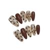 Taiwu palma dorada estampado leopardo cristal puro hecho a mano ojo de gato flash taladro champán armadura corta dulce cool arte de uñas al por mayor