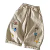 Calça Casual de Desenho Animado Infantil 2026 Primavera e Outono Novo Estilo Meninos e Meninas Bordado Fofo Calça de Pernas Retas Bebê Costura Contrastante Calça Longa Tendência