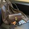 Design de nicho de alta qualidade Outono 2026 nova bolsa quadrada pequena estilosa chique personalizada simples de ombro transversal de mão