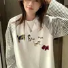 Camiseta de Manga Longa com Gola Redonda e Listras Contrastantes Estilo Coreano Estilo Ins para Mulheres Primavera e Outono Novas Blusas Casuais Soltas Estilo Preguiçoso