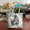 Nuevo Bolso de Mano Estilo Étnico de Yunnan, Mini, Ligero, Versátil, Billetera para Monedas de Teléfono Móvil, Bolso de Mano para Mujer con Flor Tejida con Hilo Dorado