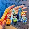 Llaveros de personaje de bombero de dibujos animados, policía de tránsito y policía, colgantes de personaje de goma suave, pequeños regalos conmemorativos, al por mayor en stock
