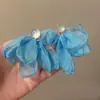 Brincos de chiffon azul com atmosfera de super fada à beira-mar, design de nicho, brincos de alta qualidade, brincos elegantes e suaves no estilo de férias