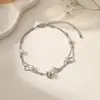 [acero de titanio de cuerpo completo] nueva moda serie de tobilleras de acero de titanio corazón de melocotón luna no se desvanece doble borla joyería para el pie
