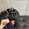 Bolsa de Ombro Única Tendência Estilo Nacional Primavera/Verão 2026 Nova Bolsa de Mão Versátil Feminina Bolsa Saco Elegante com Laço de Moda