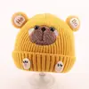 Bonitos y adorables gorros de otoño e invierno para niños, con diseño de poner, material de punto y una serie de dibujos animados, que brindan abrigo y protección para los oídos para bebés y niños pequeños.