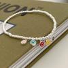 Tornozeleira colorida de verão com rosto sorridente e contas prateadas em corda elástica, estilo simples ins, pulseira versátil para amantes da moda