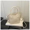 Exquisito y moderno bolso de cubo de mano, nuevo bolso cruzado versátil de moda 2026 para mujer, bolso tote pequeño de alta gama para salir
