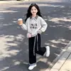Nueva sudadera de cuadros patchwork para niñas, pantalones casuales y de moda de cuadros patchwork de pierna ancha, atuendo moderno estilo universitario