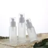 Venta al por mayor de fábrica con cabezal de bomba en botella de vidrio para emulsión, múltiples especificaciones, botella de vidrio cosmético nueva de 20-100 ml