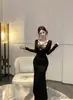 Vestido sexy de encaje falso de dos piezas cosido, estilo elegante francés de cintura alta, vestido negro ajustado de sirena