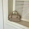 Bolso de mano de moda estilo coreano 2026 principios de otoño nuevo bolso para mujer, alto valor estético, bolso de hombro color block con decoración de cinturón, bolso cruzado