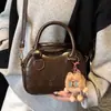 Bolsa de Bowling Retrô de Nicho para Mulheres 2026 Nova Moda Bolsa de Ombro Transversal Textura de Alta Qualidade Bolsa de Mão Cor de Café