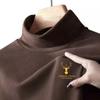 Nueva camiseta básica de cuello medio alto para otoño e invierno, ropa interior holgada y moderna para hombre, camiseta negra de manga larga con cuello medio alto para otoño.