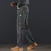 Jeans de alta gama con forro polar para hombre de Hong Kong, nuevos pantalones de negocios rectos holgados para otoño e invierno, pantalones largos casuales elásticos