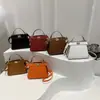 2026 Nuevo Modelo Transfronterizo Nicho Elegante Versátil Doble Cara Cerradura Bolso de Mano Bolso Cruzado Cadena Bolso para Labial Bolso de Alta Calidad para el Trabajo
