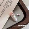 Decoración de arte de uñas con lazo de circonita, tendencia popular en línea, lazo de pedrería con forma de corazón de perla, decoración de uñas DIY terminada